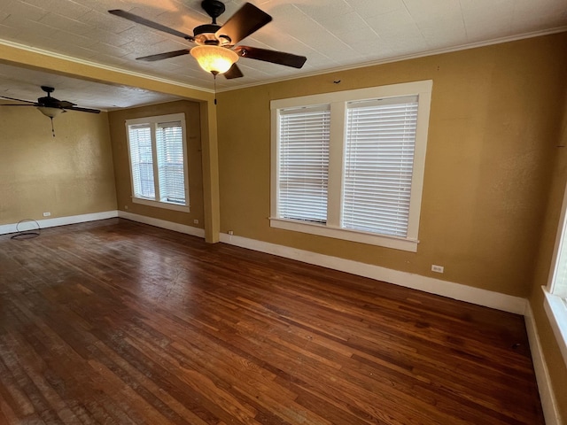 spare room featuring crown molding, ceiling fan, and dark hardwood / wood-style floors