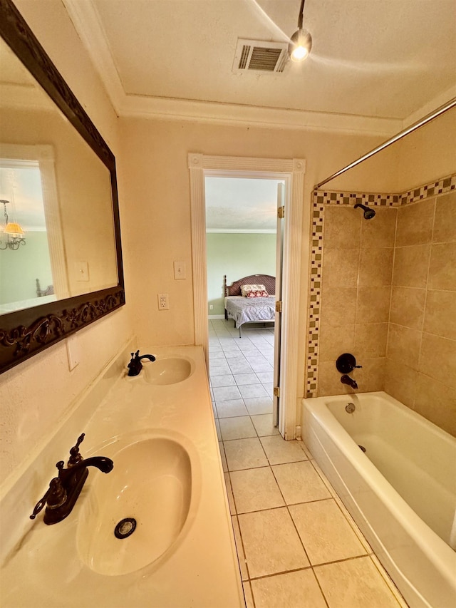 bathroom with a sink, crown molding, tile patterned flooring, and visible vents