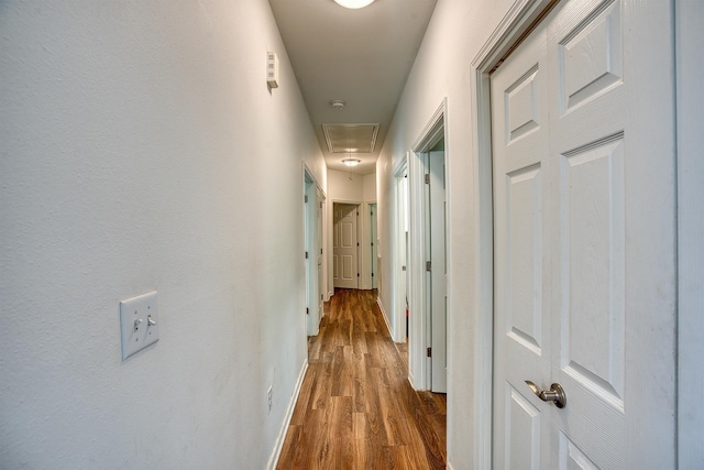 227 County Road 852, Buna, TX 77612 - hallway with attic access, wood finished floors, and baseboards