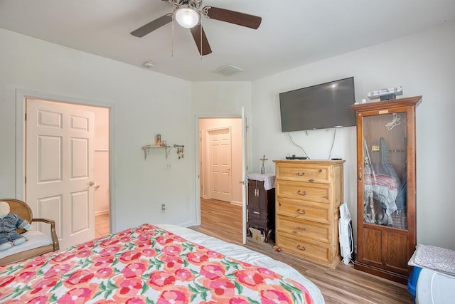 227 County Road 852, Buna, TX 77612 - bedroom with wood finished floors and ceiling fan