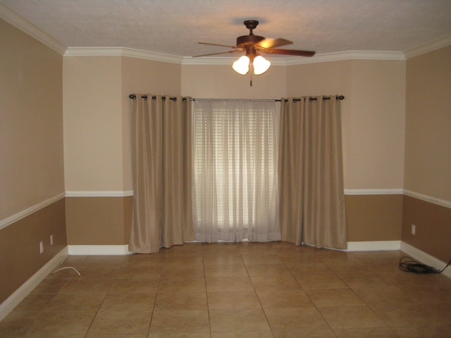 tiled empty room with a textured ceiling, ceiling fan, and crown molding