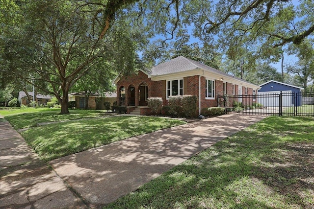 145 Manor St, Beaumont, TX 77706 - view of front of home with brick siding and driveway