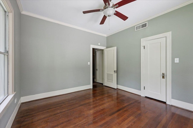 145 Manor St, Beaumont, TX 77706 - unfurnished bedroom featuring crown molding, wood finished floors, and a ceiling fan
