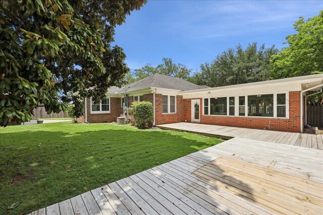 145 Manor St, Beaumont, TX 77706 - wooden deck featuring a yard