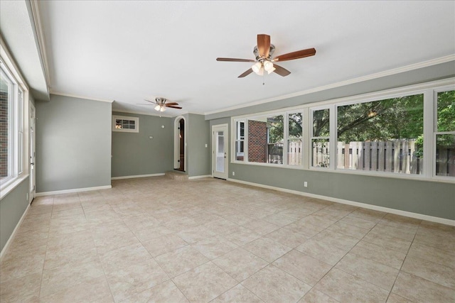 145 Manor St, Beaumont, TX 77706 - empty room featuring a ceiling fan, healthy amount of natural light, ornamental molding, and light tile patterned floors