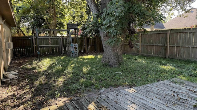 view of yard featuring a wooden deck and cooling unit