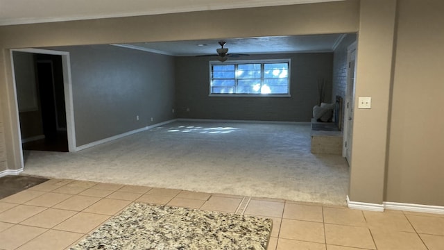 empty room featuring light colored carpet and ornamental molding