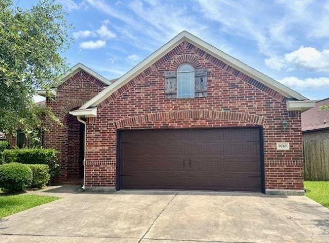9265 N Sage, Beaumont, TX 77713 - view of front of home featuring brick siding and driveway