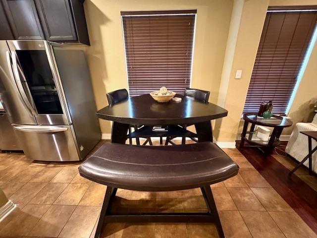 9265 N Sage, Beaumont, TX 77713 - dining room featuring tile patterned floors and baseboards