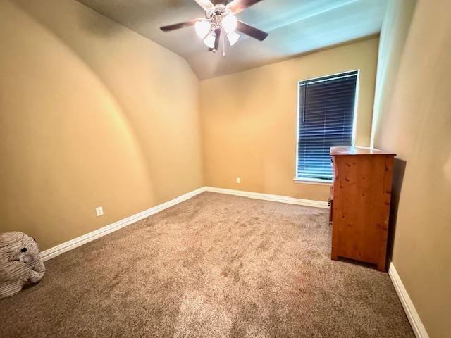 9265 N Sage, Beaumont, TX 77713 - carpeted empty room with a ceiling fan and baseboards