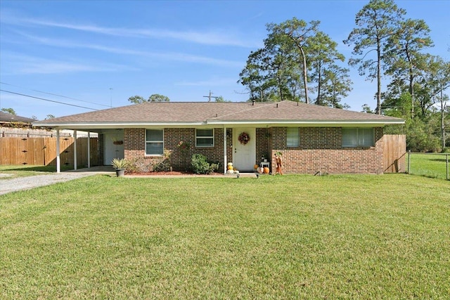 ranch-style house with a front lawn and a carport