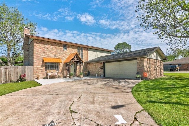 view of front property featuring a garage and a front yard