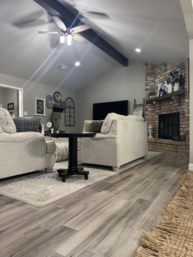 2211 Summer Oak Ln, Orange, TX 77632 - living area featuring wood finished floors, a ceiling fan, and a brick fireplace