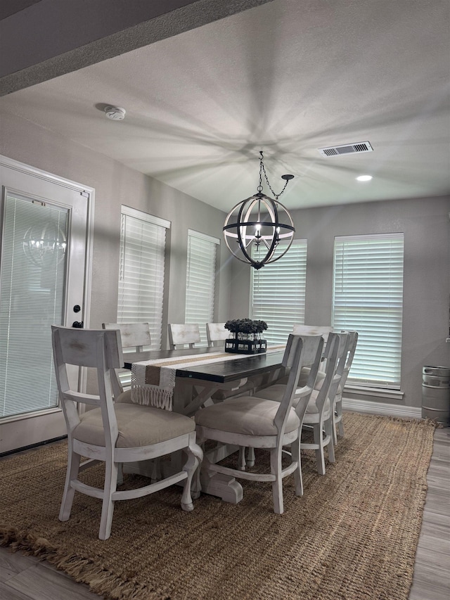 2211 Summer Oak Ln, Orange, TX 77632 - dining area with a chandelier and wood finished floors