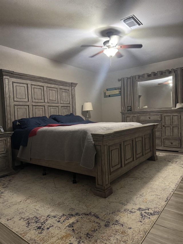 2211 Summer Oak Ln, Orange, TX 77632 - bedroom with wood finished floors and a ceiling fan