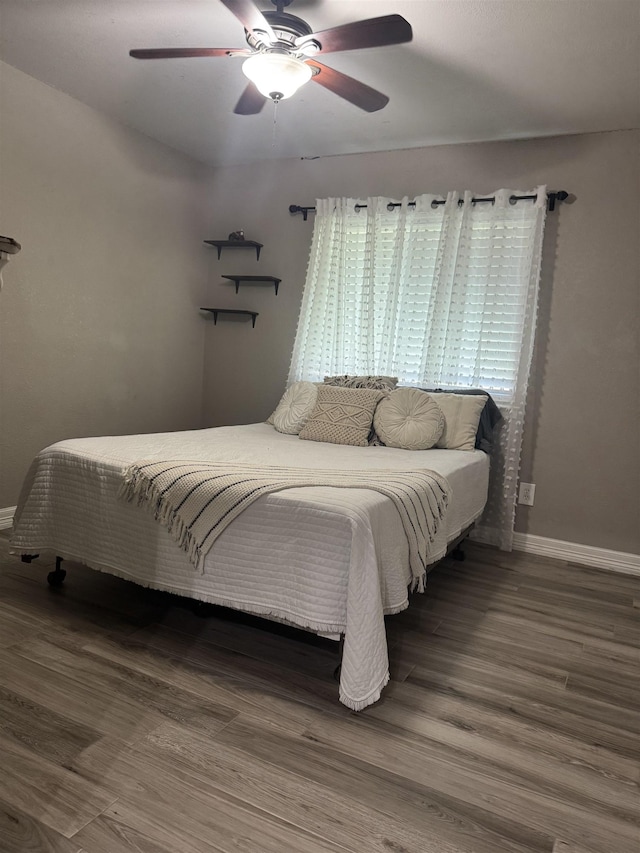 2211 Summer Oak Ln, Orange, TX 77632 - bedroom featuring a ceiling fan and wood finished floors