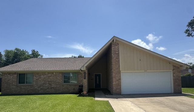 2211 Summer Oak Ln, Orange, TX 77632 - view of front of home with an attached garage, a front yard, driveway, brick siding, and a shingled roof