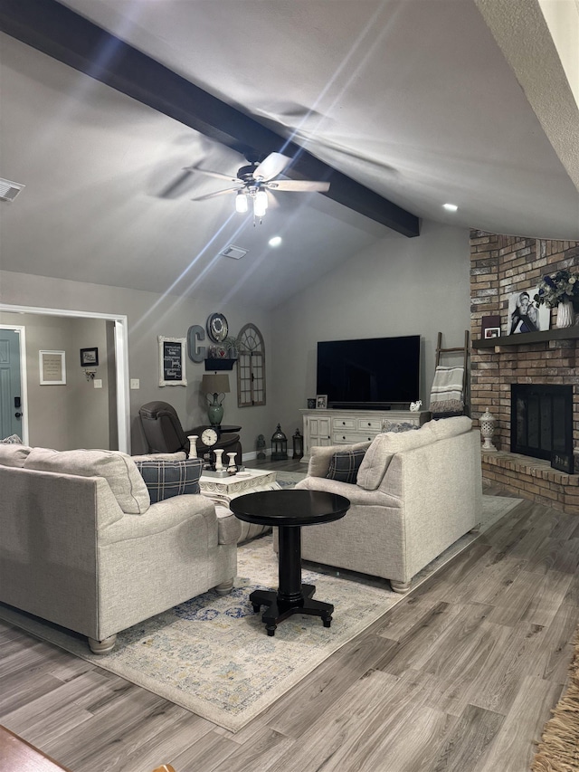 2211 Summer Oak Ln, Orange, TX 77632 - living area featuring wood finished floors, a ceiling fan, and a brick fireplace