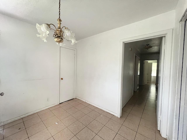 empty room with a notable chandelier