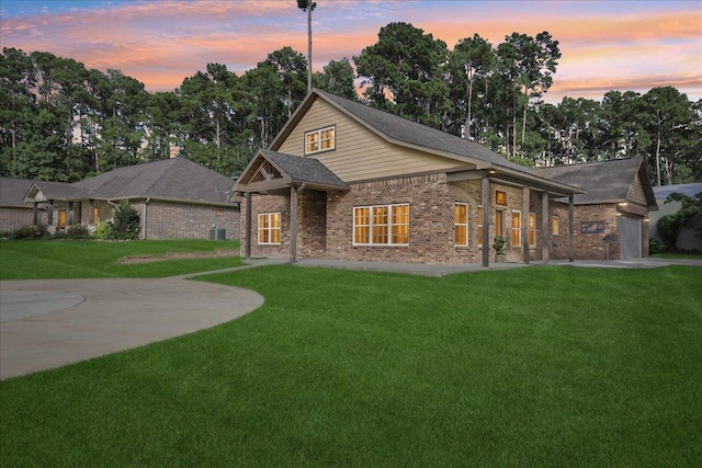 1291 Beachrock Dr, Brookeland, TX 75931 - view of front of property featuring a front yard and brick siding