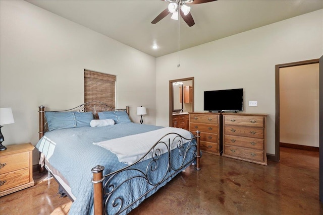 1291 Beachrock Dr, Brookeland, TX 75931 - bedroom with concrete floors, vaulted ceiling, connected bathroom, and a ceiling fan