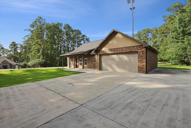 1291 Beachrock Dr, Brookeland, TX 75931 - ranch-style home with a garage, a front yard, driveway, and brick siding