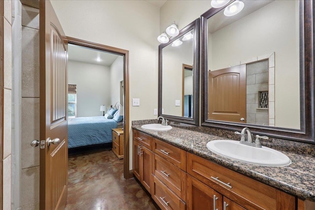 1291 Beachrock Dr, Brookeland, TX 75931 - bathroom featuring double vanity, ensuite bathroom, and concrete floors
