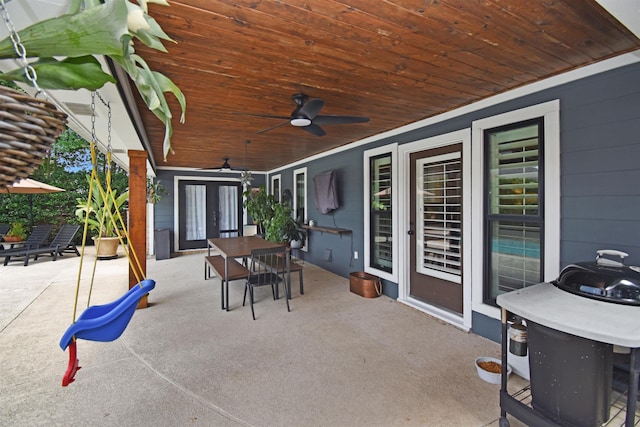 4795 Chadwick Dr, Beaumont, TX 77706 - view of patio / terrace with outdoor dining area, a ceiling fan, and french doors