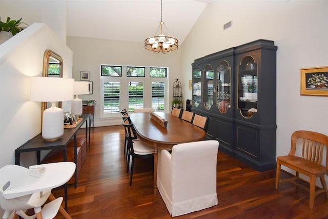 4795 Chadwick Dr, Beaumont, TX 77706 - dining room with a chandelier, dark wood-style floors, and high vaulted ceiling