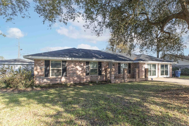 ranch-style house with brick siding and a front lawn