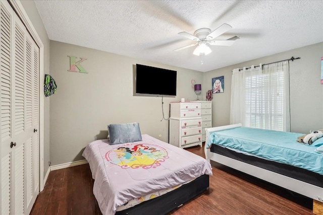 5938 W Madison Blvd, Groves, TX 77619 - bedroom with a closet, wood finished floors, baseboards, ceiling fan, and a textured ceiling