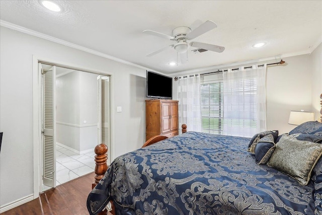 5938 W Madison Blvd, Groves, TX 77619 - bedroom featuring ornamental molding, recessed lighting, ceiling fan, wood finished floors, and baseboards