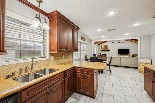 5938 W Madison Blvd, Groves, TX 77619 - kitchen featuring a sink, light marble finish floors, ceiling fan, ornamental molding, and hanging light fixtures