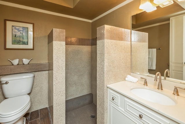 bathroom featuring walk in shower, crown molding, vanity, and toilet