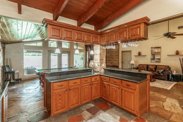 kitchen featuring french doors, pendant lighting, wooden ceiling, dark stone countertops, and beamed ceiling