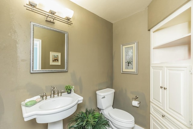 bathroom with toilet and sink