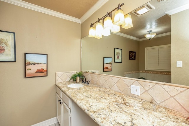 bathroom with vanity, crown molding, and tasteful backsplash