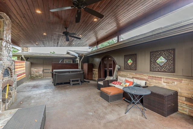 view of patio with a hot tub and ceiling fan