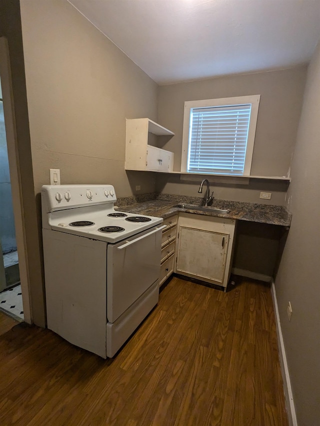 kitchen featuring white range with electric stovetop, dark hardwood / wood-style floors, and sink