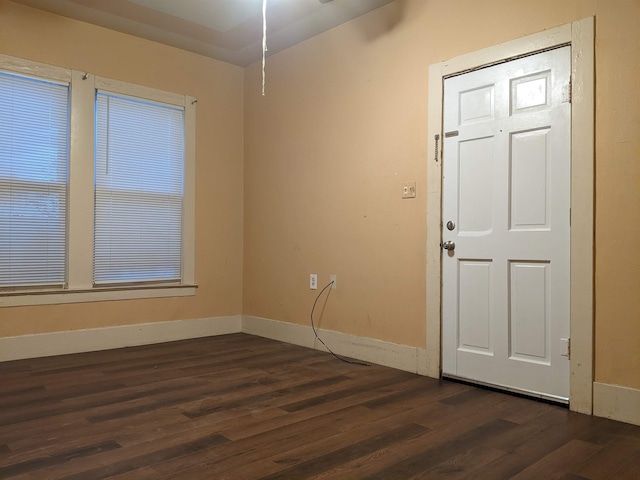 spare room featuring dark hardwood / wood-style floors