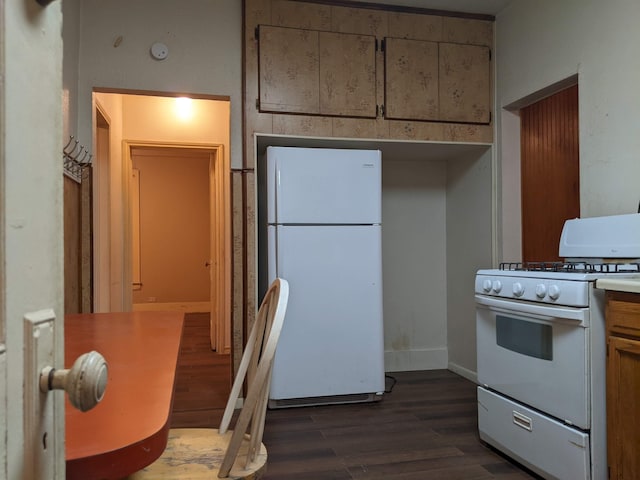 kitchen with dark wood-type flooring and white appliances