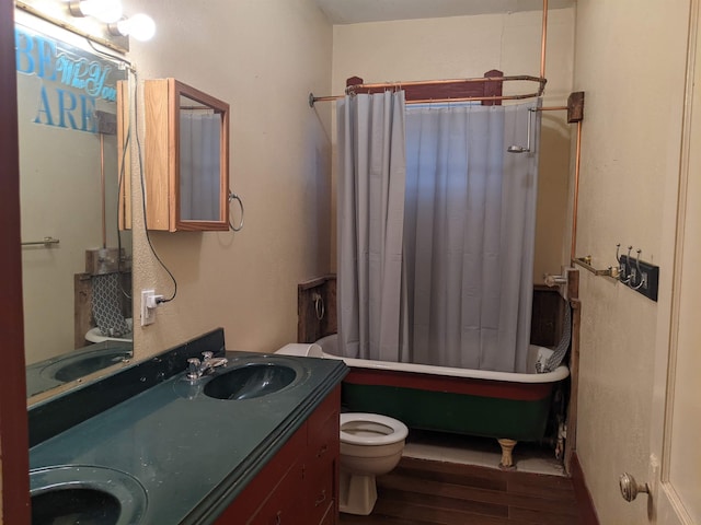 full bathroom featuring hardwood / wood-style flooring, vanity, toilet, and shower / bathtub combination with curtain