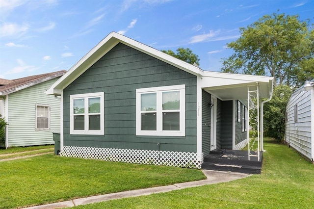 view of home's exterior with a lawn