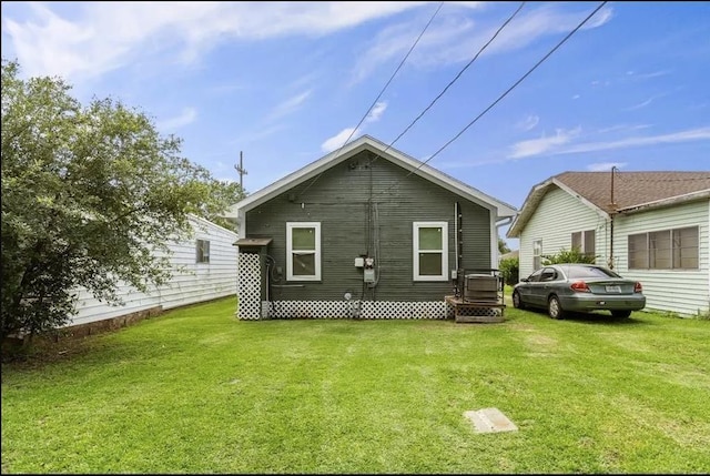 back of house with a yard