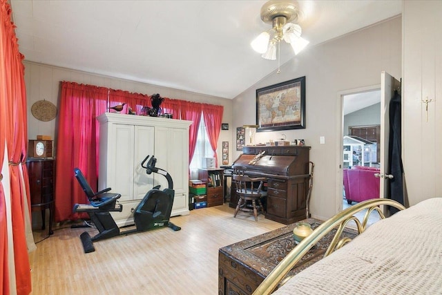 interior space featuring ceiling fan, wood-type flooring, and lofted ceiling