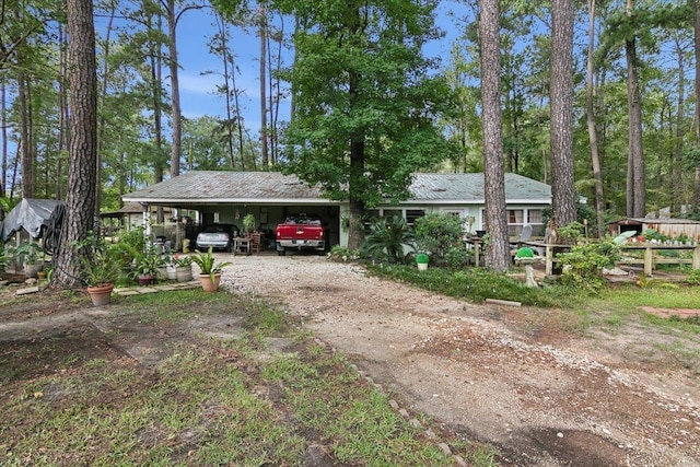 ranch-style house with a carport