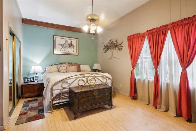 bedroom with ceiling fan and light hardwood / wood-style floors