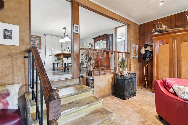 stairway with wood walls