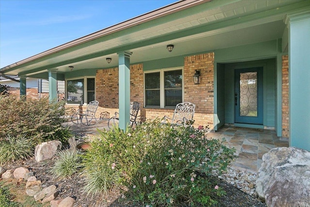 doorway to property featuring covered porch