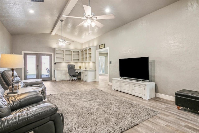 living room with french doors, light wood-type flooring, lofted ceiling with beams, and ceiling fan